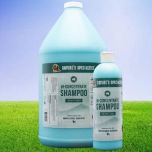 A bottle of shampoo and a container on the grass.
