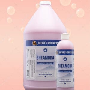 A bottle of shampoo and conditioner on a pink background