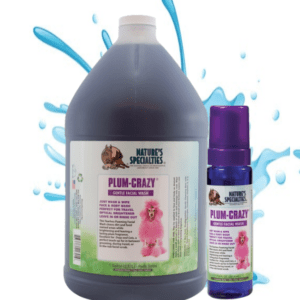 A bottle of purple liquid and spray bottle.