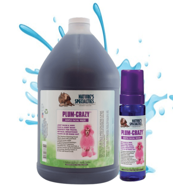 A bottle of purple liquid and spray bottle.